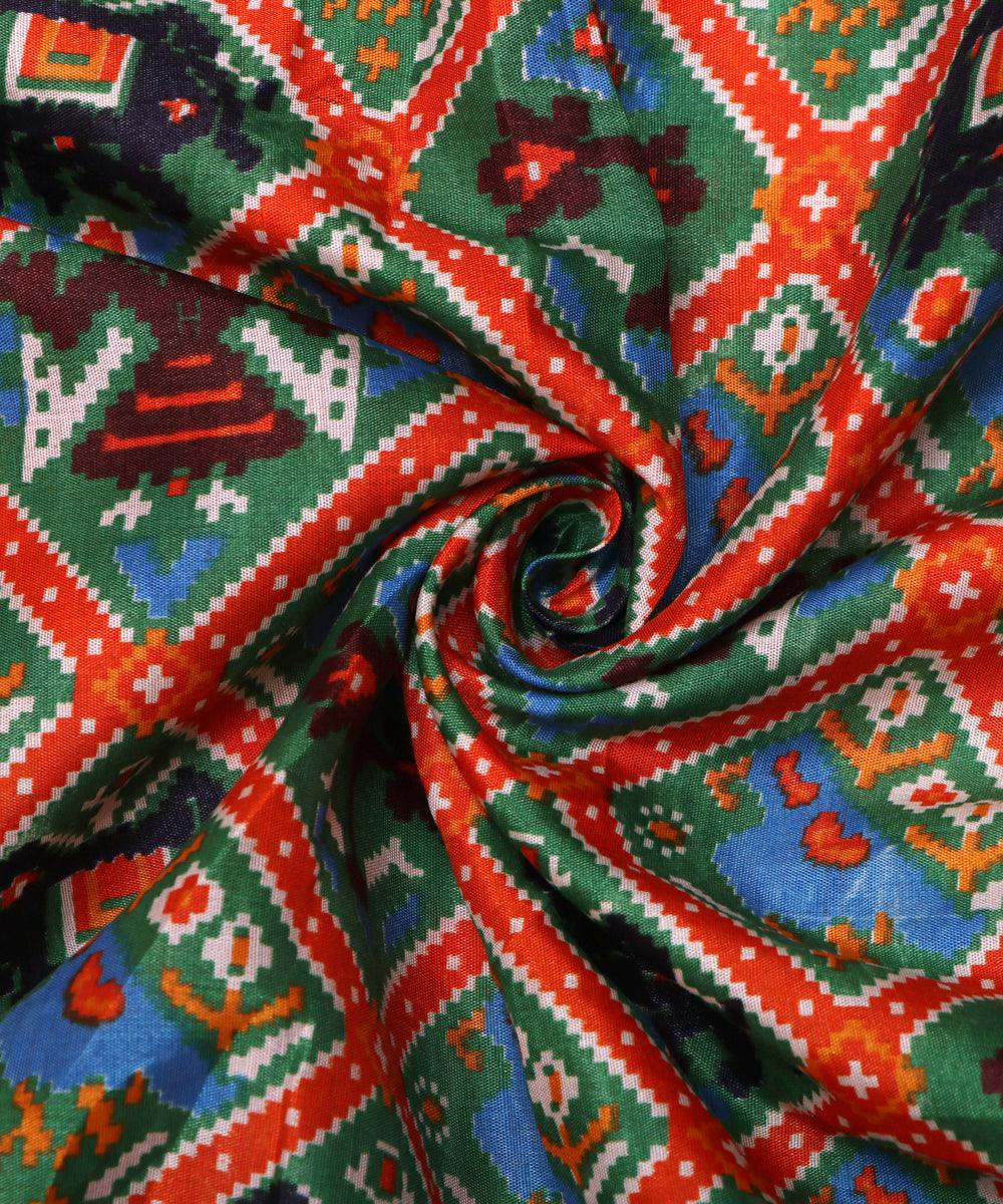 green rust blue black patola print silk fabric