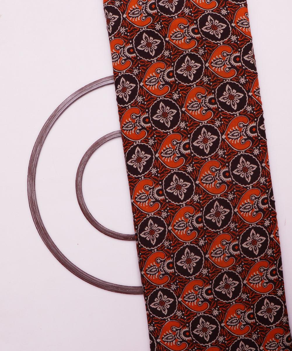 brown and orange ajrakh print rayon fabric